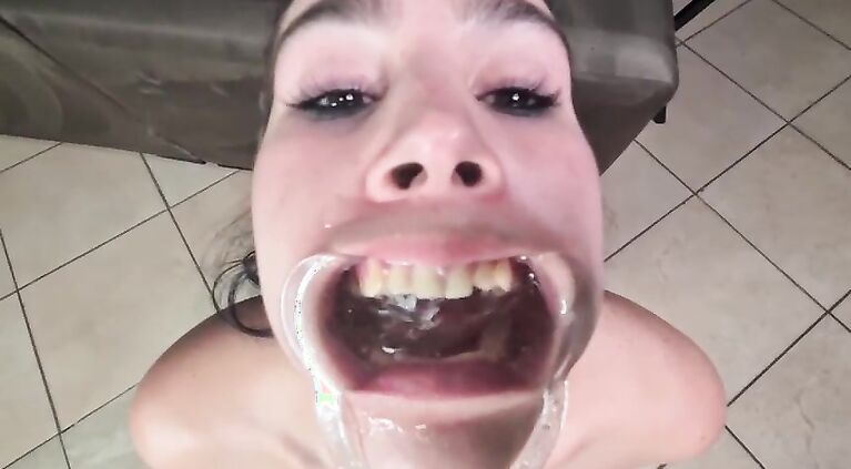 Human toilet drinking and gargling piss with a lip retractor
